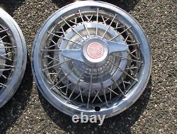 Factory 1964 1965 Pontiac 15 inch wire spoke spinner hubcaps wheel covers