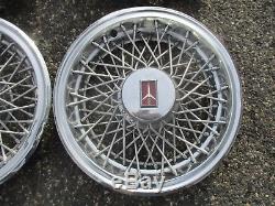 Oldsmobile Cutlass 14 inch metal wire spoke hubcaps wheel covers set