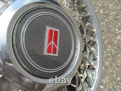 One NOS 1991 to 1994 Oldsmobile Cutlass Ciera wire spoke hubcap wheel cover