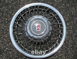 One NOS 1991 to 1994 Oldsmobile Cutlass Ciera wire spoke hubcap wheel cover